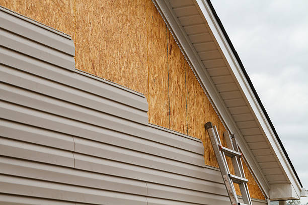 Professional Storm Damage Siding Repair technician working in West Sunbury, PA